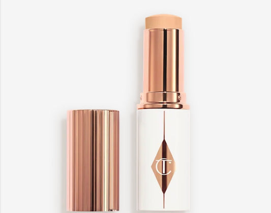 CHARLOTTE TILBURY - 
UNREAL SKIN SHEER GLOW TINT HYDRATING - FONDOTINTA STICK