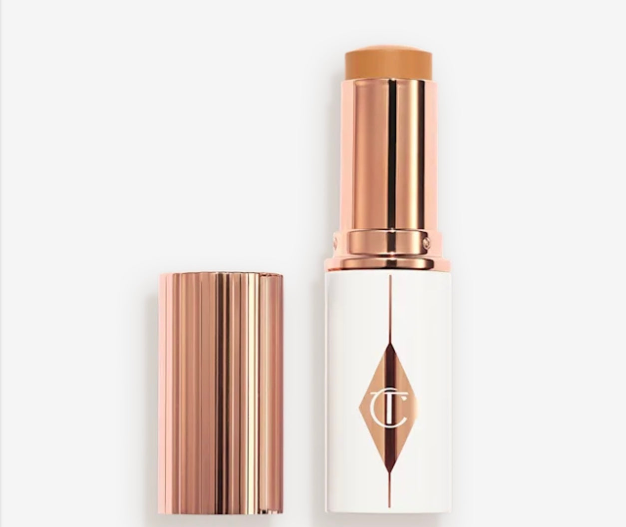 CHARLOTTE TILBURY - 
UNREAL SKIN SHEER GLOW TINT HYDRATING - FONDOTINTA STICK