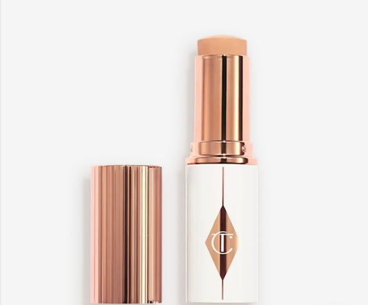 CHARLOTTE TILBURY - 
UNREAL SKIN SHEER GLOW TINT HYDRATING - FONDOTINTA STICK